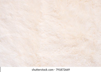 Pale Pink Shaggy Blanket Texture As Background. Fluffy Fake Textile Fur.