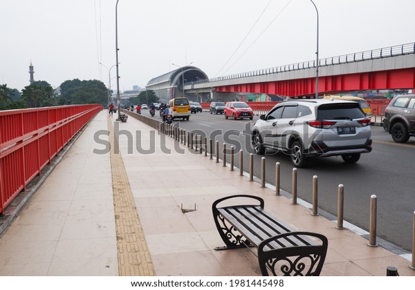 PALEMBANG, INDONESIA - 20-05-2021; In the\
afternoon at the Ampera bridge and the busy traffic is full of\
vehicles. Ampera bridge, South\
Sumatra