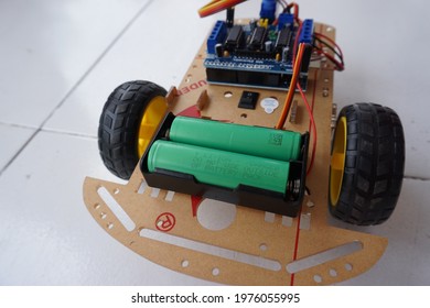 Palembang, Indonesia - April 4, 2021: Two 18650 Batteries Are Used As Power Two Wheel Drive Robot Car Obstacle Avoidance With Ultrasonic Sensors.