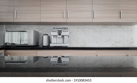 PALEMBANG, INDONESIA - February 4, 2021: Kitchen Counter With Coffee Maker And Microwave On Top 