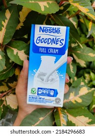 PALEMBANG, INDONESIA - JULY 30th, 2022 - Milk Box Flavour Full Cream In Hand With Nestle Brand.