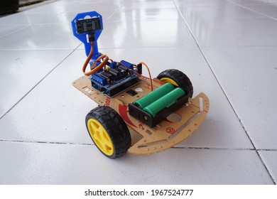 Palembang, Indonesian - April 4, 2021 : A Programmable Two Wheel Drive Robot Car With Obstacle Avoidance With Ultrasonic Sensors And And 18650 Battery 