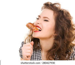 paleo diet concept - young woman eating meat
