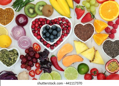 Paleo diet health and superfood of fruit, vegetables, nuts and seeds in heart shaped bowls on distressed white wood background, high in vitamins, antioxidants, dietary fiber and minerals. - Shutterstock ID 441117370