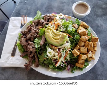 Paleo Salad: Tofu, Beef, Citrus Slaw, Organic Kale, Mixed Greens & Sliced Avocado. 