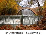 Paleokarya, old, stone, arched bridge, between two waterfalls. Trikala prefecture, Thessaly, Greece