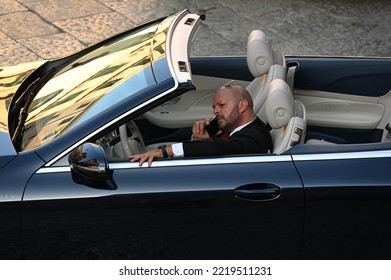 Palermo, Italy - October 22, 2022: Chauffeur On The Phone Waiting In A Luxury Limousine