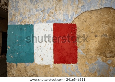 Palermo, Sicily, Italy An Italian flag painted on the side of an old building.