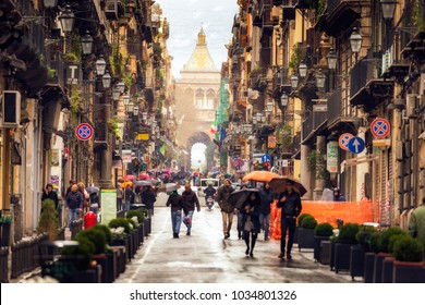 Palermo, Sicily/Italy - February 20 2018: Rainy Days In Palermo. People Walking Through The Inner City Of Palermo