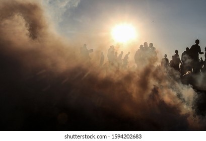 Palestinian demonstrators clash with Israeli security forces during a protest along the border with Israel, in the eastern part of the Gaza Strip, Dec 20, 2019. Photo by Photo by Abed Rahim Khatib - Shutterstock ID 1594202683