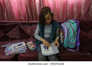 Palestinian Girl Studies Her School Meals At Her Home During The Disruption Of United Nations UNRWA Schools For Three Days A Week During The Outbreak Of The Coronavirus In Gaza Strip, On Mar 14, 2021.