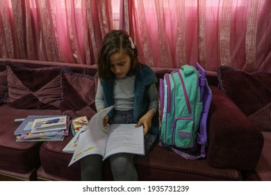 Palestinian Girl Studies Her School Meals At Her Home During The Disruption Of United Nations UNRWA Schools For Three Days A Week During The Outbreak Of The Coronavirus In Gaza Strip, On Mar 14, 2021.