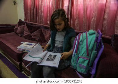 Palestinian Girl Studies Her School Meals At Her Home During The Disruption Of United Nations UNRWA Schools For Three Days A Week During The Outbreak Of The Coronavirus In Gaza Strip, On Mar 14, 2021.