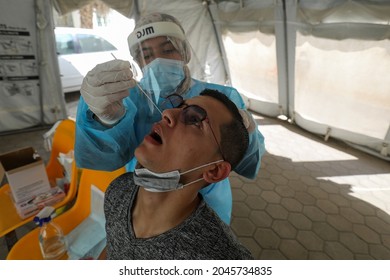 Palestinian Health Worker Takes Samples For Coronavirus At A Health Center In Rafah, In The Southern Gaza Strip, On September 22, 2021.