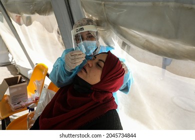 Palestinian Health Worker Takes Samples For Coronavirus At A Health Center In Rafah, In The Southern Gaza Strip, On September 22, 2021.