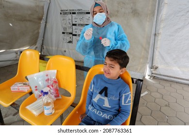 Palestinian Health Worker Takes Samples For Coronavirus Of Covid-19 At A Health Center In Rafah, In The Southern Gaza Strip, On December 8, 2021.