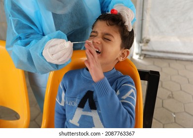 Palestinian Health Worker Takes Samples For Coronavirus Of Covid-19 At A Health Center In Rafah, In The Southern Gaza Strip, On December 8, 2021.