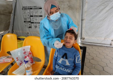 Palestinian Health Worker Takes Samples For Coronavirus Of Covid-19 At A Health Center In Rafah, In The Southern Gaza Strip, On December 8, 2021.