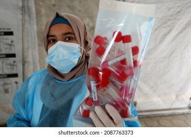 Palestinian Health Worker Takes Samples For Coronavirus Of Covid-19 At A Health Center In Rafah, In The Southern Gaza Strip, On December 8, 2021.