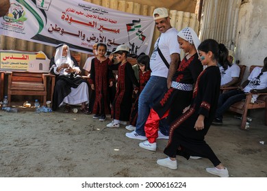 Palestinians Participate During The Revival Of Heritage Event On The Occasion Of World Refugee Day Next Sunday In The Maghazi Refugee Camp In The Central Gaza Strip, On July 1, 2021.