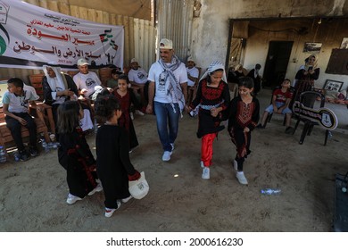 Palestinians Participate During The Revival Of Heritage Event On The Occasion Of World Refugee Day Next Sunday In The Maghazi Refugee Camp In The Central Gaza Strip, On July 1, 2021.