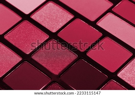 Palette of colorful eyeshadows from high view. New 2023 trending PANTONE 18-1750 Viva Magenta color