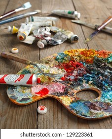 Palette With Oil Paint And Palette-knife.