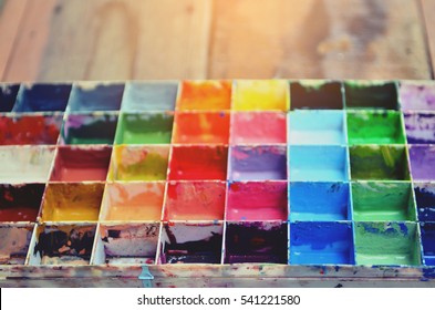  The Palette Water Paints On The Table,many Color In  The Palette Water Paints