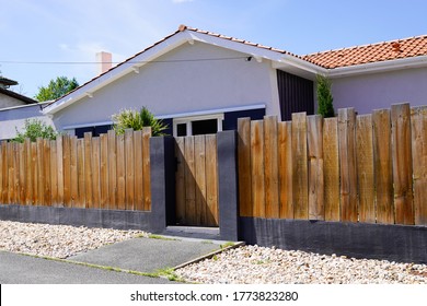 palisade wooden panel fence for home and gate access garden house - Shutterstock ID 1773823280