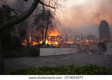 Palisades fire burning down a large home