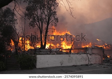 Palisades fire burning down a large home