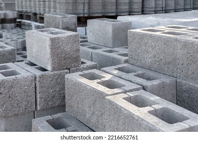 Pallet of Concrete Cinder Blocks, Grey Uniformed brick Shapes building material. New for use on construction site in europe - Shutterstock ID 2216652761