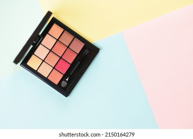 Pallet Shadows For Applying On Face On Multicolored Background. Eye Shadow And Eyeliner. Womens Beauty.