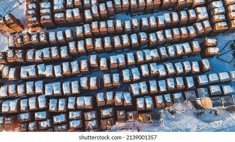 Pallets of bricks for construction. Outdoor storage in winter. Warehousing of large quantities of bricks. View from above