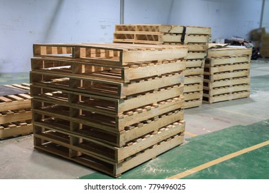Pallets wood in factory - Shutterstock ID 779496025