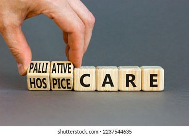 Palliative or hospice care symbol. Concept word Palliative care Hospice care on wooden cubes. Doctor hand. Beautiful grey table grey background. Medical palliative or hospice care concept. Copy space. - Powered by Shutterstock