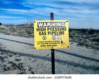 Palm Desert, California - March 4, 2019: Warning Sign In The Desert Points Out Underground High Pressure Gas Line.