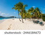 Palm fringed white sand beach on Palm Island with Union Island in the background, the Grenadines, St. Vincent and the Grenadines, Windward Islands, West Indies, Caribbean, Central America