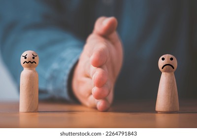 Palm hand blocking and divide between Man and woman wooden figure for resolving conflict and mediate management concept. - Shutterstock ID 2264791843