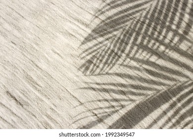Palm leaves shadows overlay with copy space on beige linen fabric background. Summer vacation and beach holiday concept photo