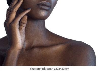 Palm and lips of young beautiful black woman with clean perfect skin close-up. Skin care and beauty concept