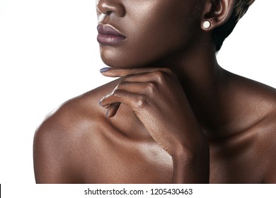 Palm and lips of young beautiful black woman with clean perfect skin close-up. Skin care and beauty concept