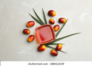 Palm Oil In Glass Bowl, Tropical Leaf And Fruits On Light Table, Flat Lay