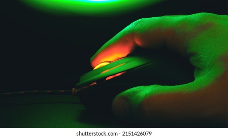 Palm On A Computer Mouse Glowing In The Dark