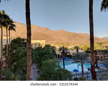 Palm Springs, California - October 26, 2018:  Renaissance Palm Springs Hotel Pool During Morning With Moon Over The Mountain.