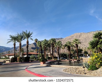 Palm Springs, California, United States - October 28, 2018:  Fountain Pool At Renaissance Palm Springs Hotel Entrance.  Set Against A Backdrop Of Swaying Palm Trees And The Majestic San Jacinto.