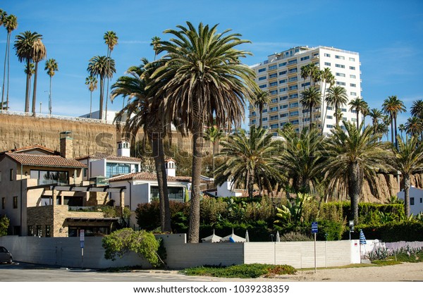 PALM SPRINGS, USA - FEBRUARY\
15 2018: View of the buildings surrounded by palm trees in\
california