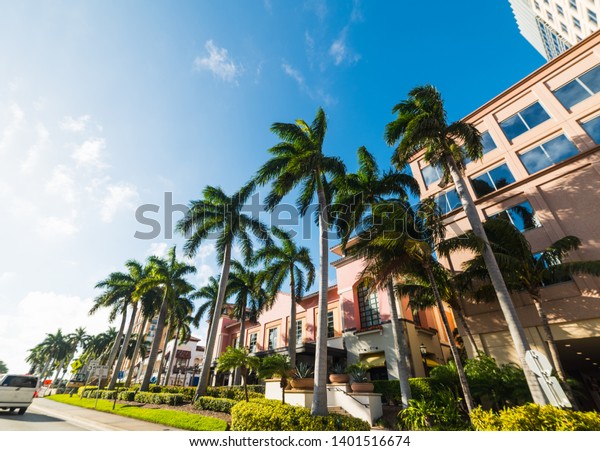 Palm trees and elegant buildings in West Palm Beach.\
Florida, USA