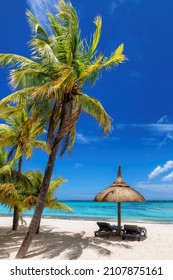 Palm trees in tropical sunny beach and tropical sea in Mauritius island. Summer vacation and tropical beach concept. - Shutterstock ID 2107875161