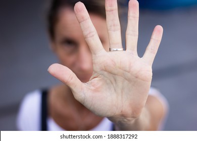 Palm Of White Hand Of Anonymous Woman Wide Open. Violence Against Women Social Criticism Concept